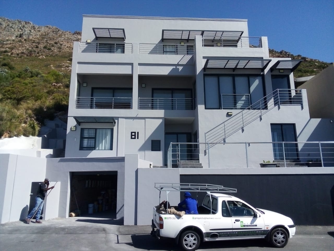 Full exterior repaint of a three-storey home set against the mountain in Cape Town