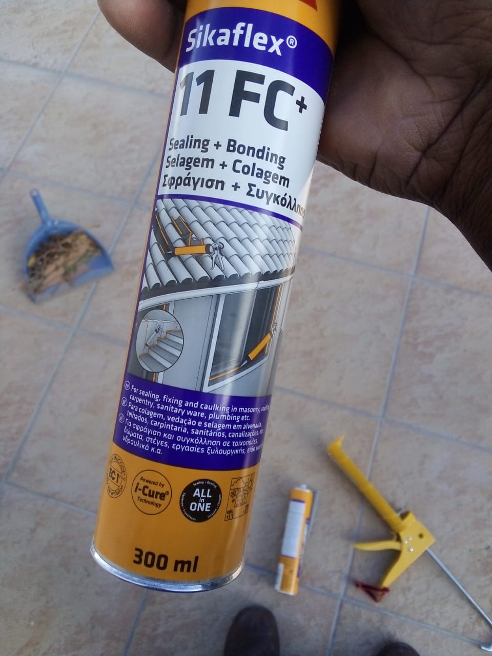 Close-up of a Sikaflex sealant tube and caulking gun used for sealing joints